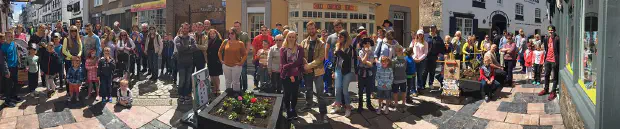 A crowd gathered to watch Kristien Harris performing his street magic show